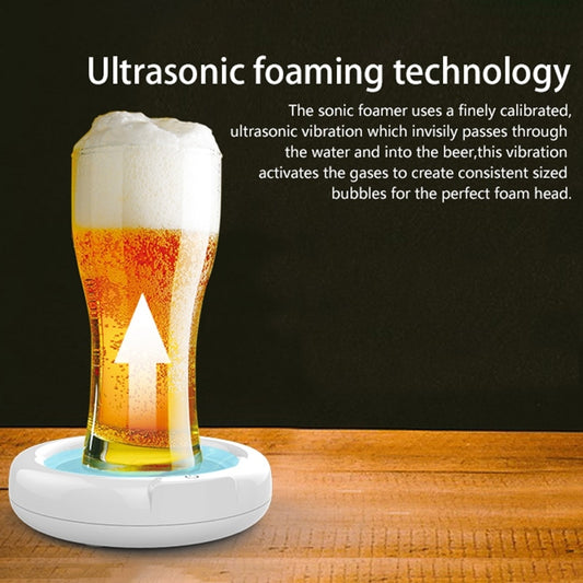 Ultrasonic beer frother creating foam in a glass of beer